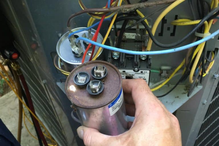 a worn and damaged air conditioning capacitor, which can lead to system failure and other problems.