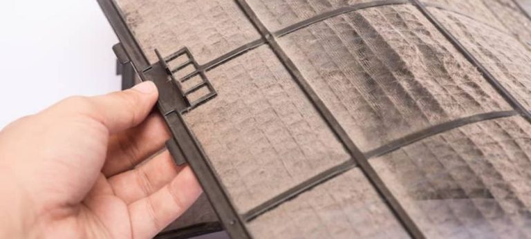 an image of an air conditioning system with a dirty air filter, showing the negative effects of clogged or dirty air filters, including strain on the system, poor indoor air quality, and potential damage to critical components. the image also includes factors that contribute to clogged or dirty air filters, such as high usage, poor indoor air quality, irregular maintenance, and pet dander and hair.