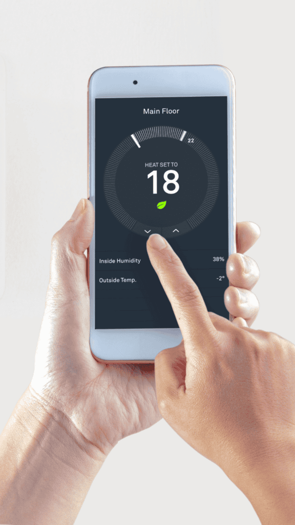 Close-up of a smart thermostat displaying temperature settings, offering efficient control of home heating and compatibility with furnace systems for optimized energy use.